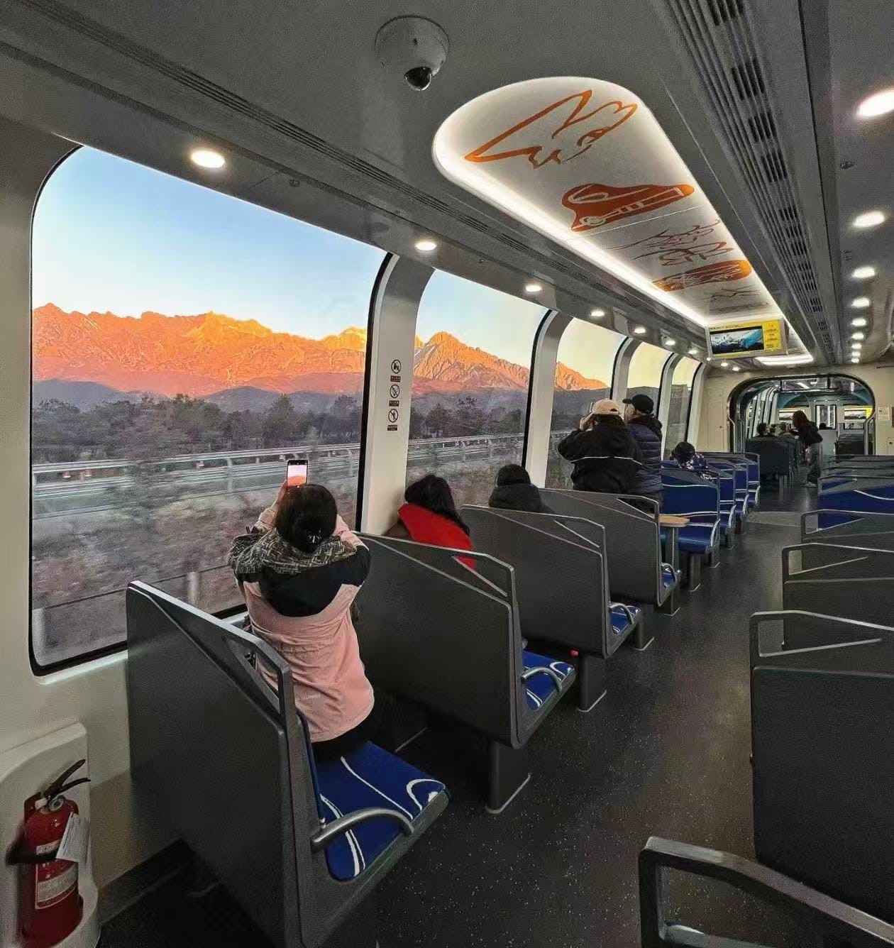 Passengers Enjoying Scenic Mountain Views