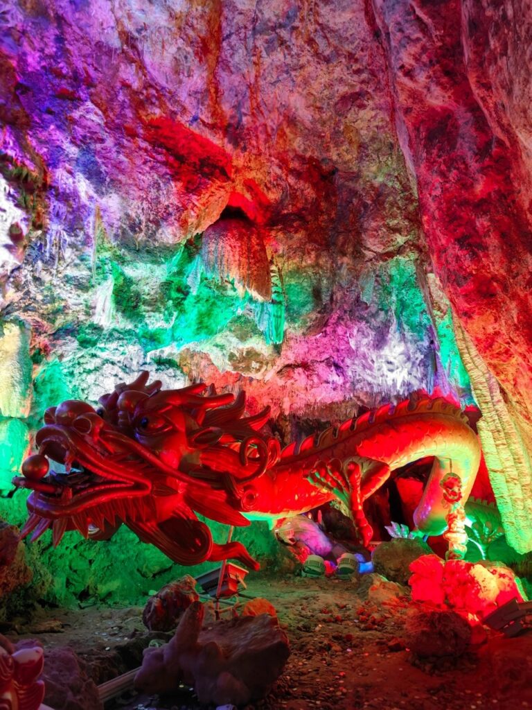 Jinsuo Island, Dali: Ferry, Longgong Cave And A Quiet Bai Village 6 Inside The Brilliantly Illuminated Karst Cave, Lit Up In A Riot Of Colors Like A Dragon Palace, Sits A Stone Sculpture Of A Chinese Dragon.