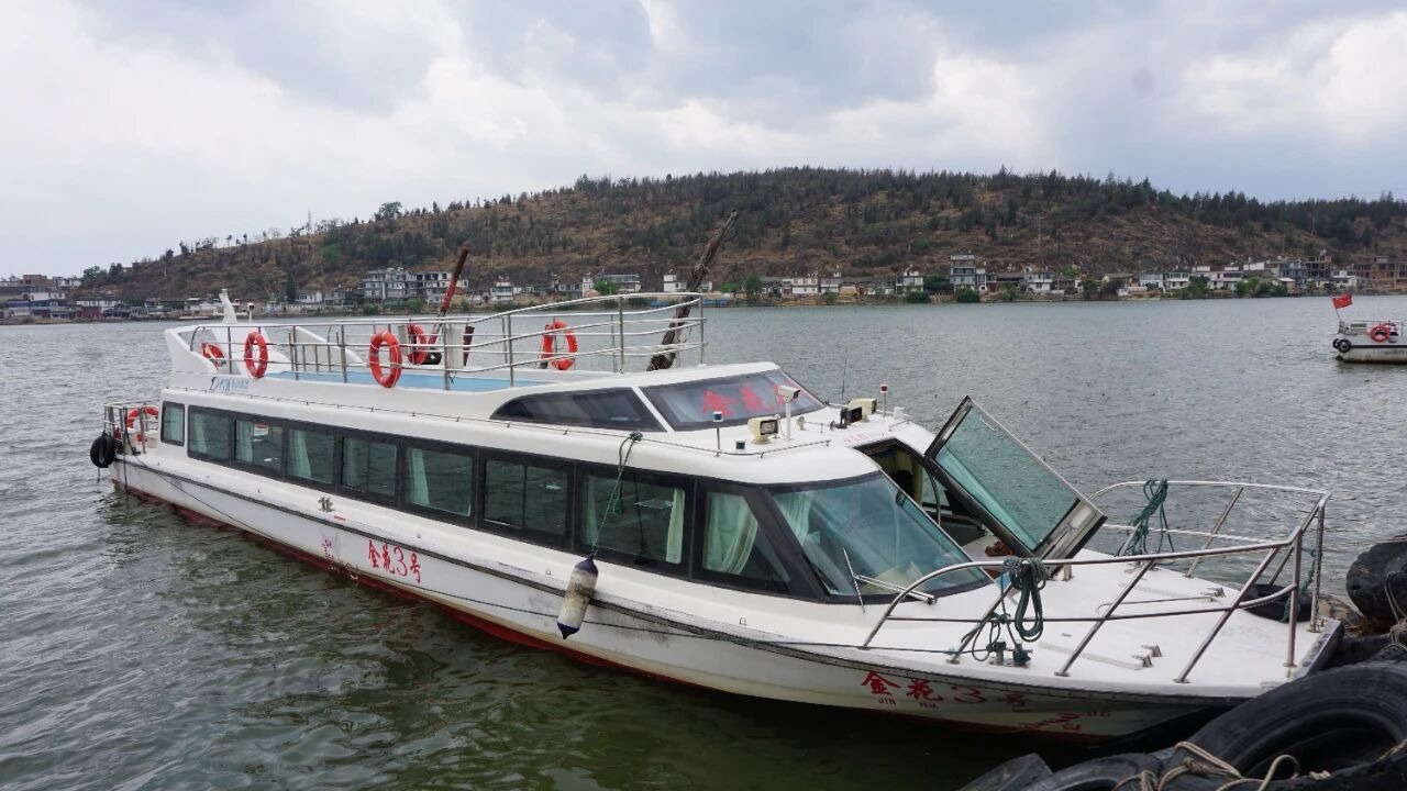 Jinsuo Island, Dali: Ferry, Longgong Cave And A Quiet Bai Village 12 A Tour Boat Moored On The Lake