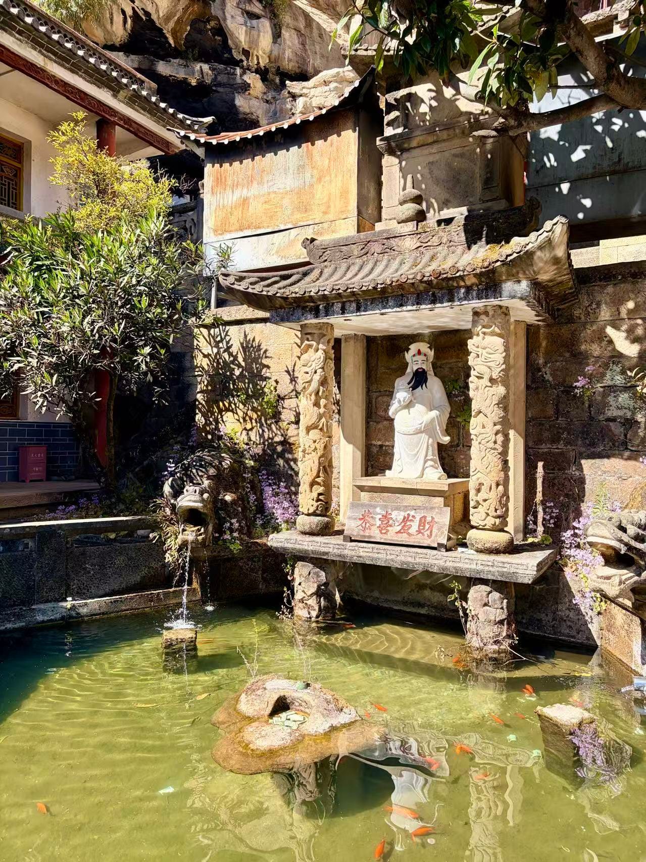 Statue Of The God Of Wealth And The Pond Inside Baoxiang Temple