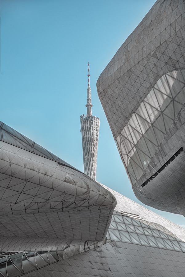 A Very Tall Building With A Very Tall Tower In The Background