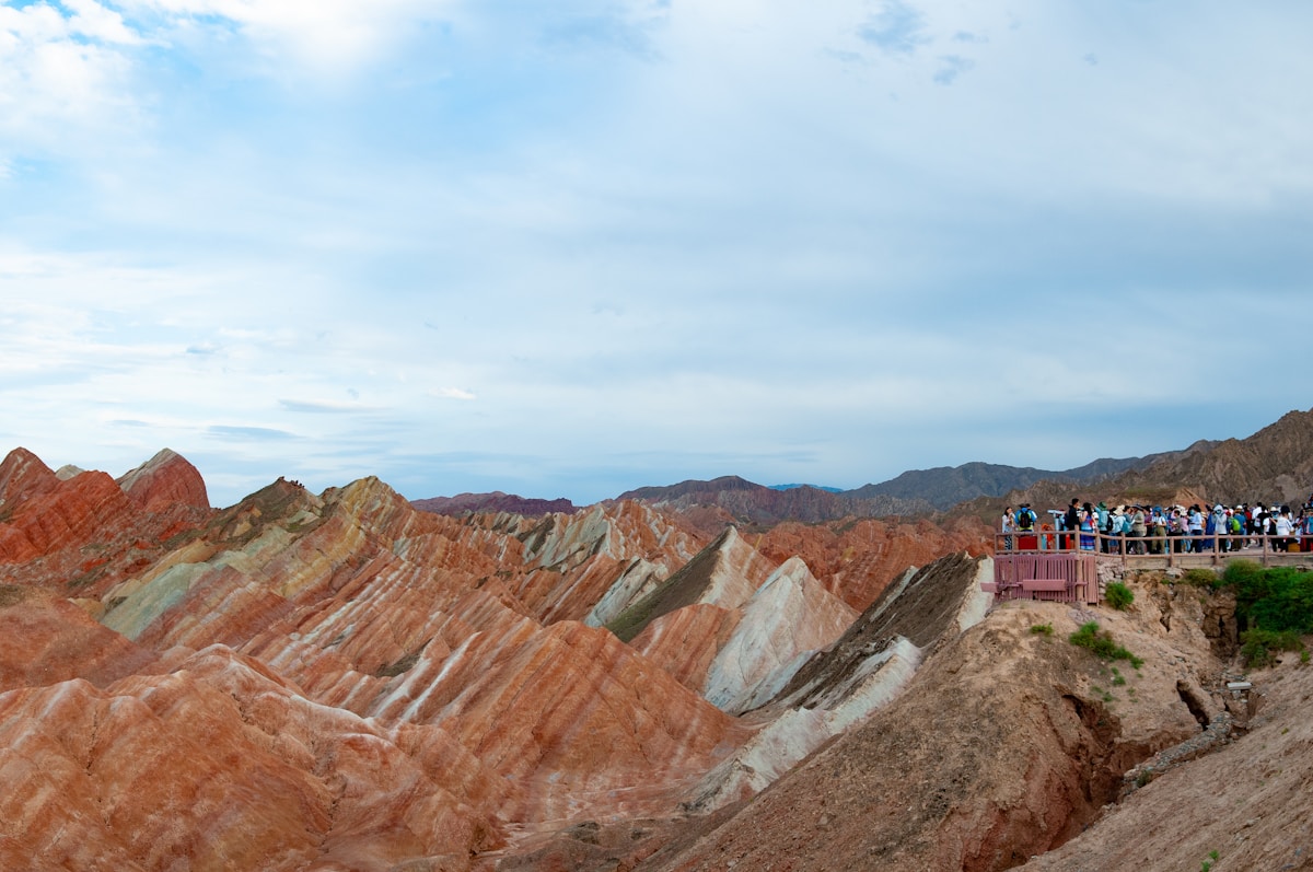 Zhangye National Geopark: The Ultimate Guide To Rainbow Mountains Of China 8 Brown And Gray Mountains Under White Clouds And Blue Sky During Daytime