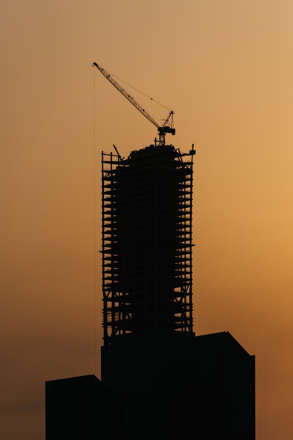 Noise Pollution In China: What Travelers Should Know 5 A Tall Building With A Crane On Top Of It