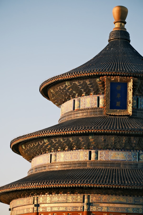Temple Of Heaven: China'S Most Sacred Imperial Complex 16 A Tall Building With A Clock On The Top Of It