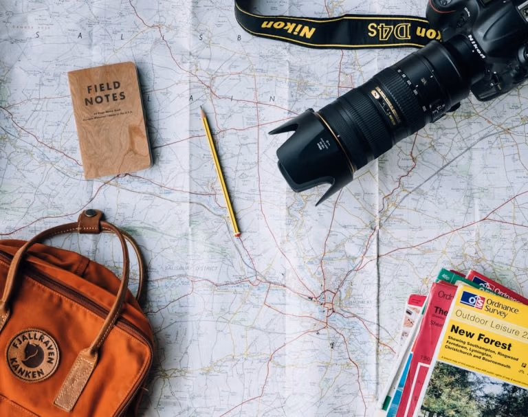 38 China Travel Tips Only Locals Know 13 Flat Lay Photography Of Camera, Book, And Bag