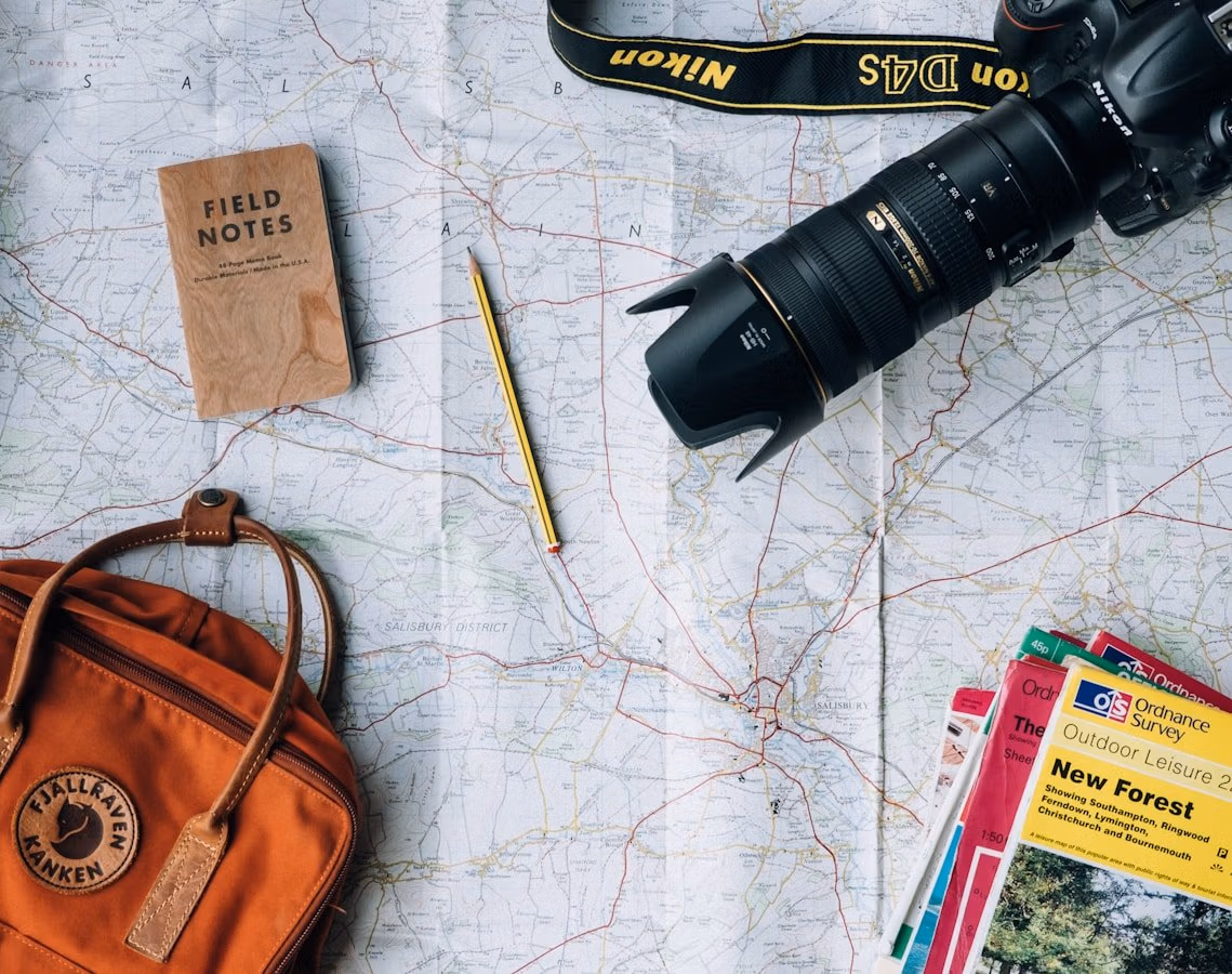 38 China Travel Tips Only Locals Know 1 Flat Lay Photography Of Camera, Book, And Bag